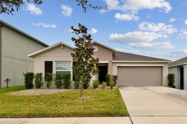 ranch-style home with a garage and a front yard