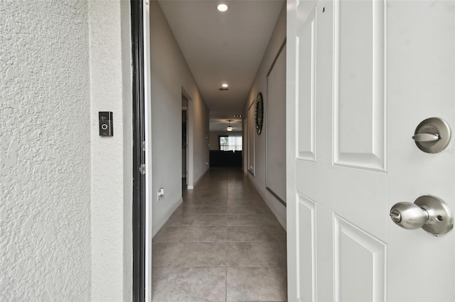 corridor featuring tile patterned flooring