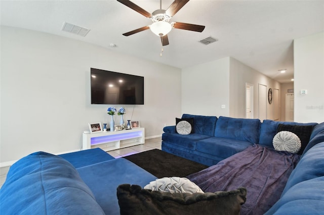 tiled living room featuring ceiling fan