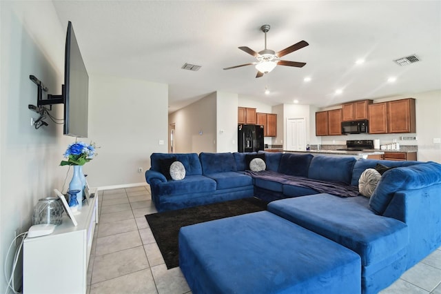 tiled living room with ceiling fan