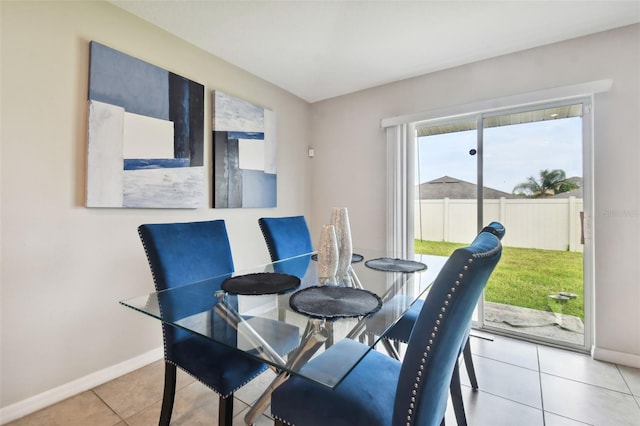 dining area featuring light tile patterned floors