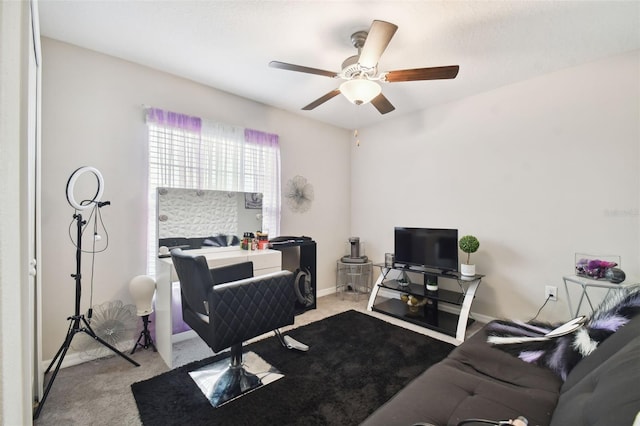 office with ceiling fan and light carpet