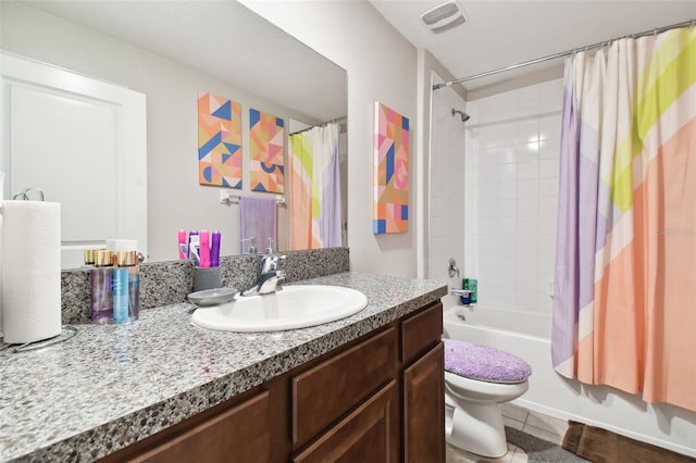 full bathroom with vanity, tile patterned floors, toilet, and shower / tub combo with curtain