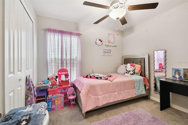 bedroom with a closet, light carpet, and ceiling fan