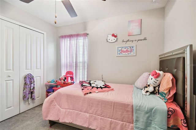 bedroom featuring ceiling fan, light carpet, and a closet