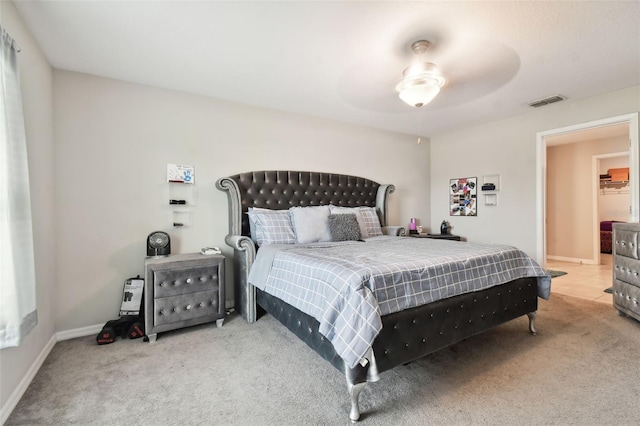 carpeted bedroom with ceiling fan