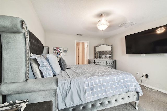 bedroom with ceiling fan and carpet floors