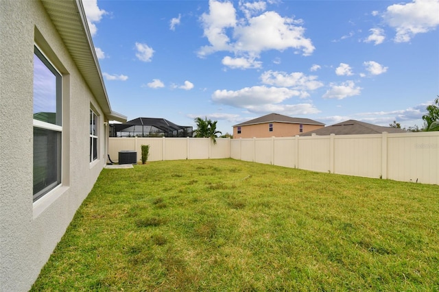 view of yard with central AC