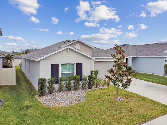 ranch-style house featuring a garage and a front lawn