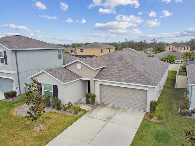 view of front of home with a garage and a front yard