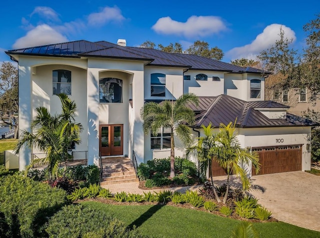 view of front of home featuring a garage and french doors