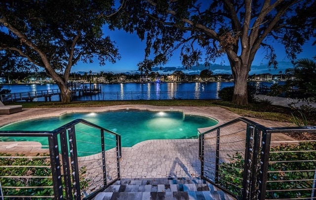 view of pool featuring a water view