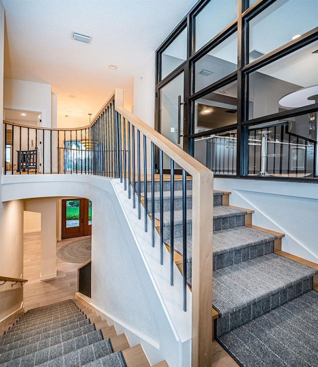 stairway featuring hardwood / wood-style flooring