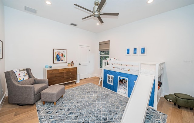 living area featuring ceiling fan and light hardwood / wood-style floors