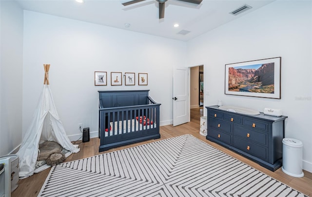 bedroom featuring hardwood / wood-style floors and ceiling fan