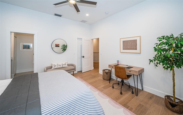 bedroom with ceiling fan and light hardwood / wood-style flooring