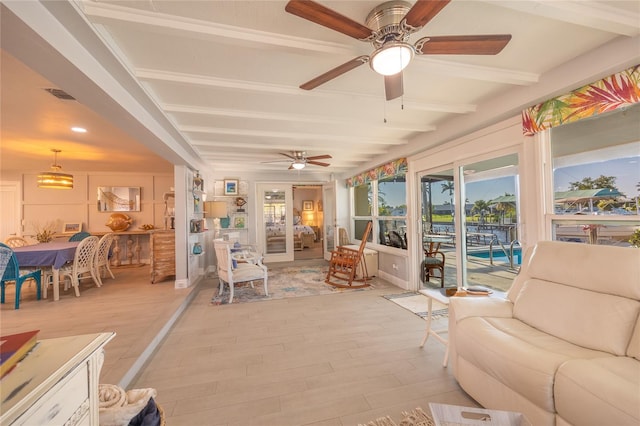 sunroom / solarium featuring beam ceiling, ceiling fan, and a swimming pool