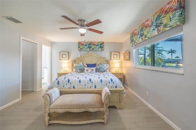 bedroom with ceiling fan and light hardwood / wood-style floors