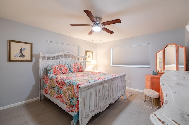 bedroom with hardwood / wood-style flooring and ceiling fan