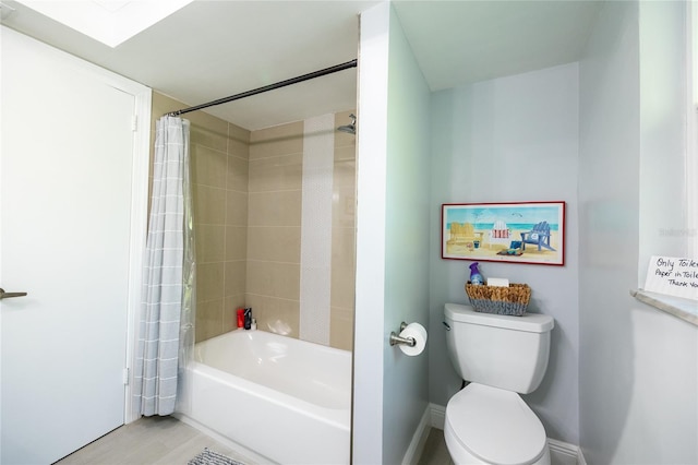 bathroom featuring shower / bath combo, toilet, and wood-type flooring