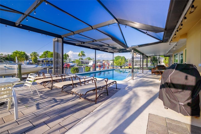 view of swimming pool with a patio and grilling area