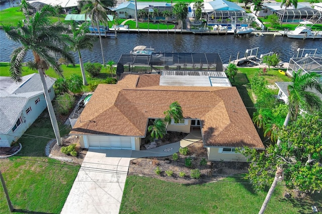 birds eye view of property with a water view