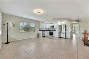 unfurnished living room featuring light tile patterned floors