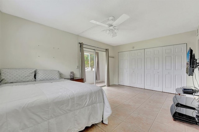 bedroom with ceiling fan and light tile patterned floors