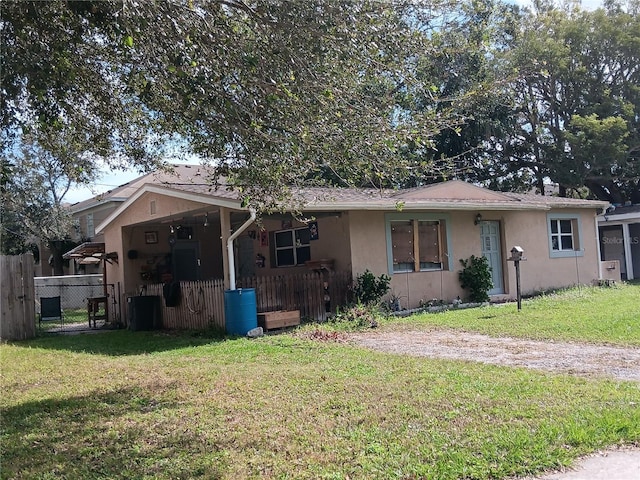 rear view of house with a lawn