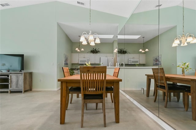 dining space featuring high vaulted ceiling and a notable chandelier