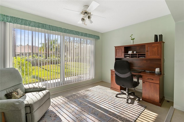 office with a wealth of natural light and ceiling fan