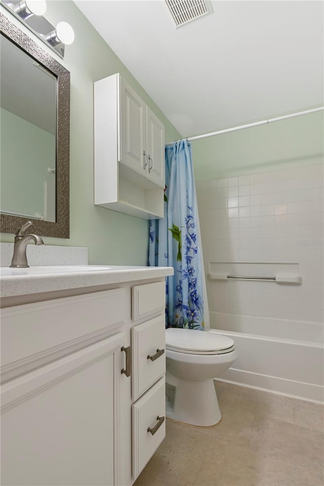 full bathroom with tile patterned flooring, shower / bath combination with curtain, vanity, and toilet