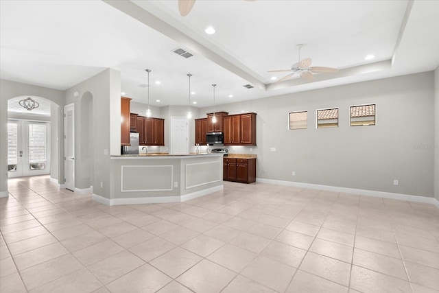 kitchen featuring french doors, stainless steel appliances, light tile patterned floors, pendant lighting, and ceiling fan