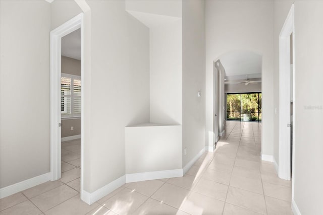 corridor featuring light tile patterned flooring