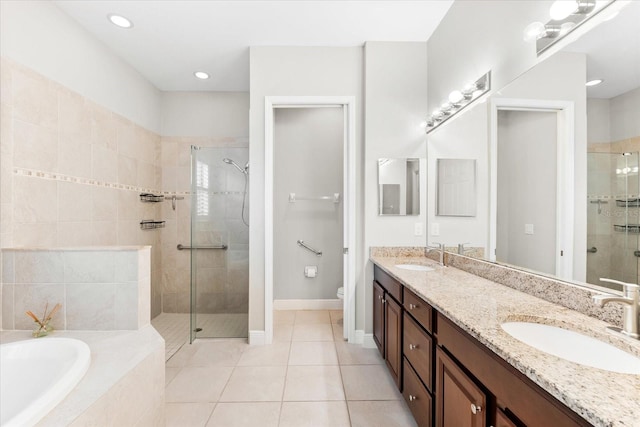 full bathroom featuring vanity, tile patterned flooring, toilet, and separate shower and tub