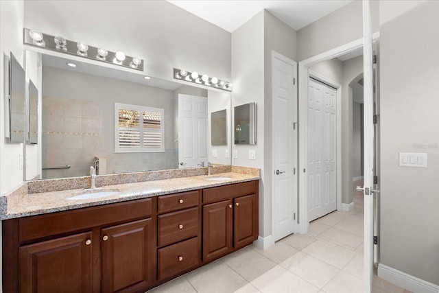 bathroom with vanity and tile patterned floors