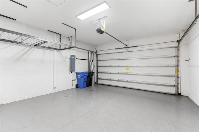 garage featuring a garage door opener and electric panel