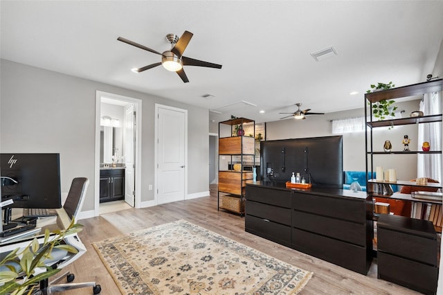 office area with ceiling fan and light hardwood / wood-style floors