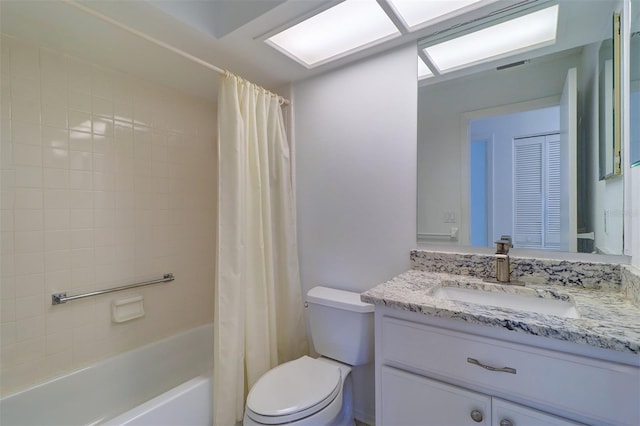 full bathroom featuring vanity, shower / bathtub combination with curtain, and toilet