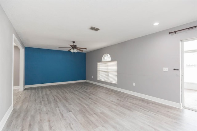 spare room featuring ceiling fan and light hardwood / wood-style floors