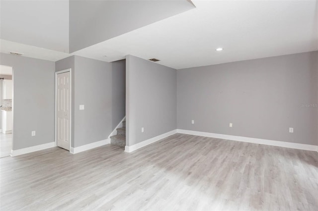 spare room featuring light wood-type flooring