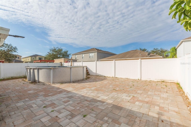 view of patio with a fenced in pool