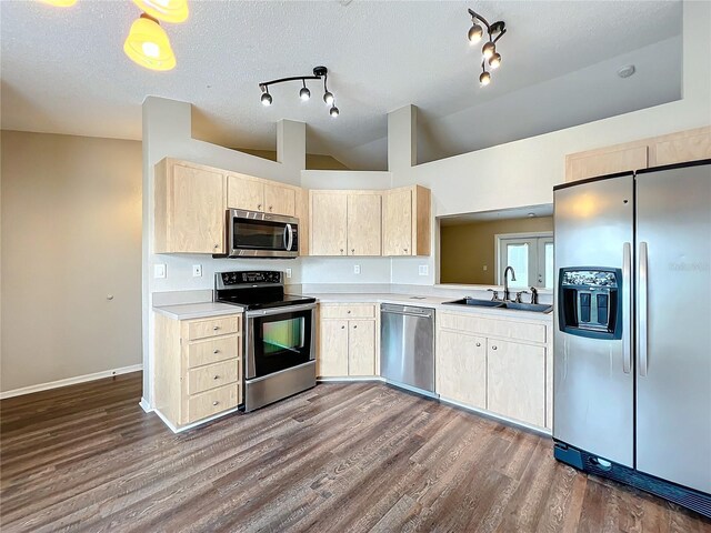 kitchen featuring dark hardwood / wood-style flooring, light brown cabinetry, appliances with stainless steel finishes, and sink