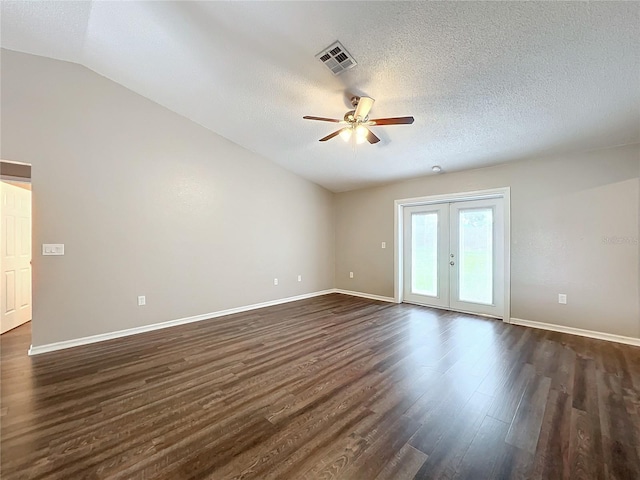 unfurnished room with ceiling fan, french doors, a textured ceiling, dark hardwood / wood-style flooring, and vaulted ceiling