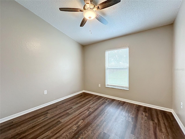 unfurnished room with dark wood-type flooring, a textured ceiling, and ceiling fan