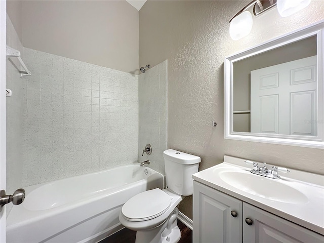 full bathroom featuring vanity, toilet, and tiled shower / bath