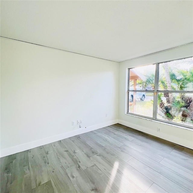 empty room with light hardwood / wood-style floors