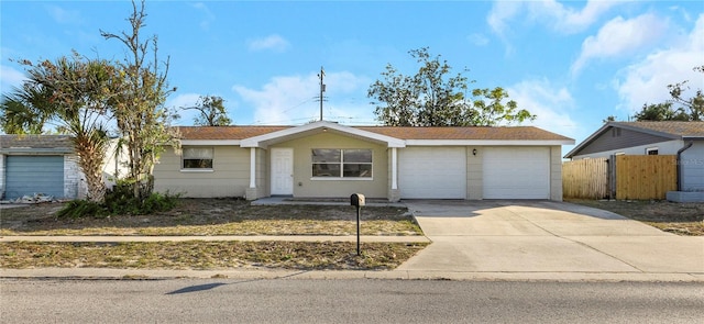 ranch-style house featuring a garage