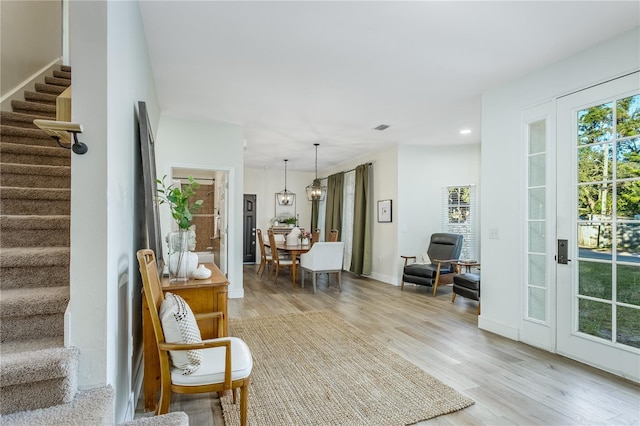 living area with light hardwood / wood-style flooring