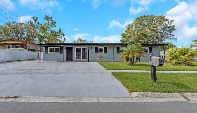 single story home featuring a front yard